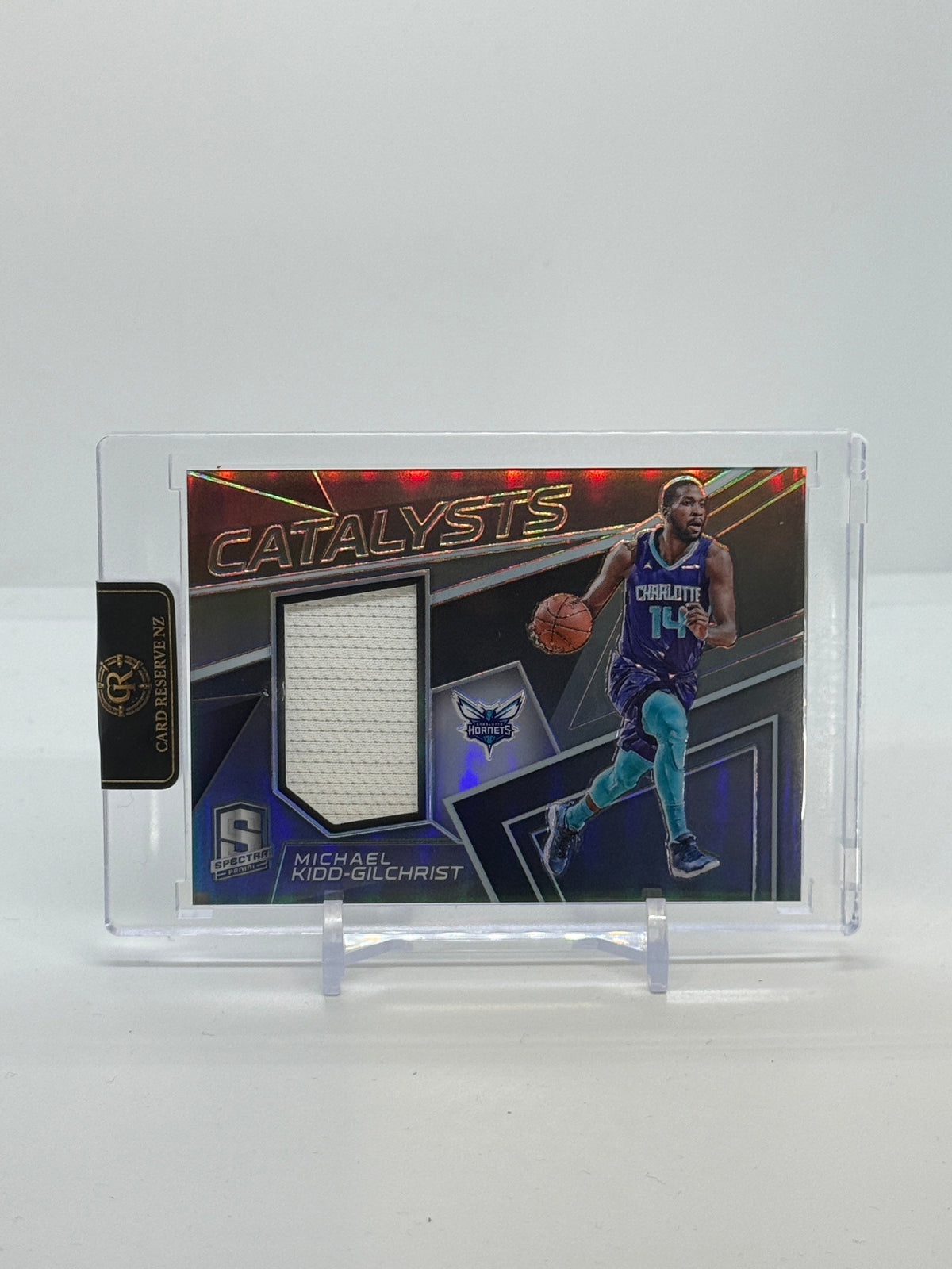 03 2017-18 Panini Spectra Michael Kidd-Gilchrist Catalysts Game-Worn Jersey 076/199 #CAT-24 - 2017-18 Panini Spectra Michael Kidd-Gilchrist Catalysts Game-Worn Jersey 076/199 #CAT-24 — Raw actual front