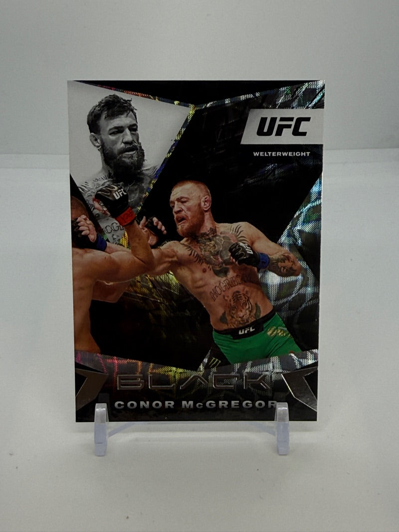 01 2021 Panini Chronicles UFC Panini Black Conor McGregor #115 - 2021 Panini Chronicles UFC Panini Black Conor McGregor #115 — Raw — front